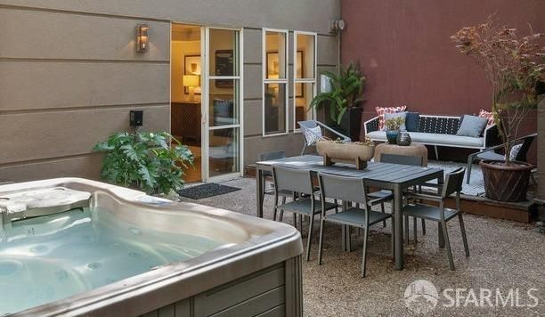 a view of a dining room with furniture and a potted plant