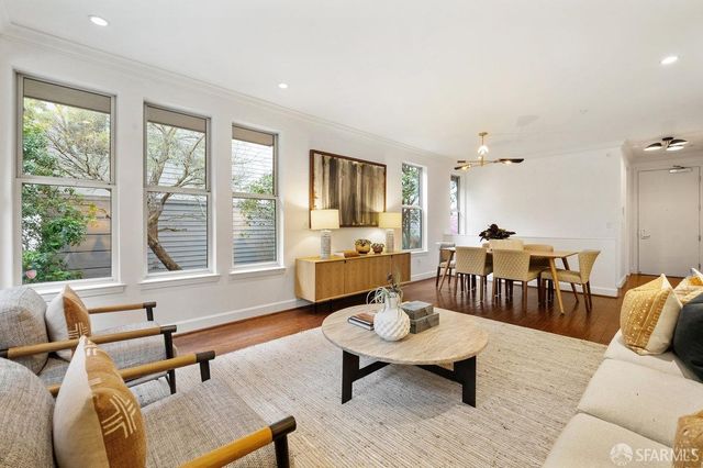 a living room with furniture and a table