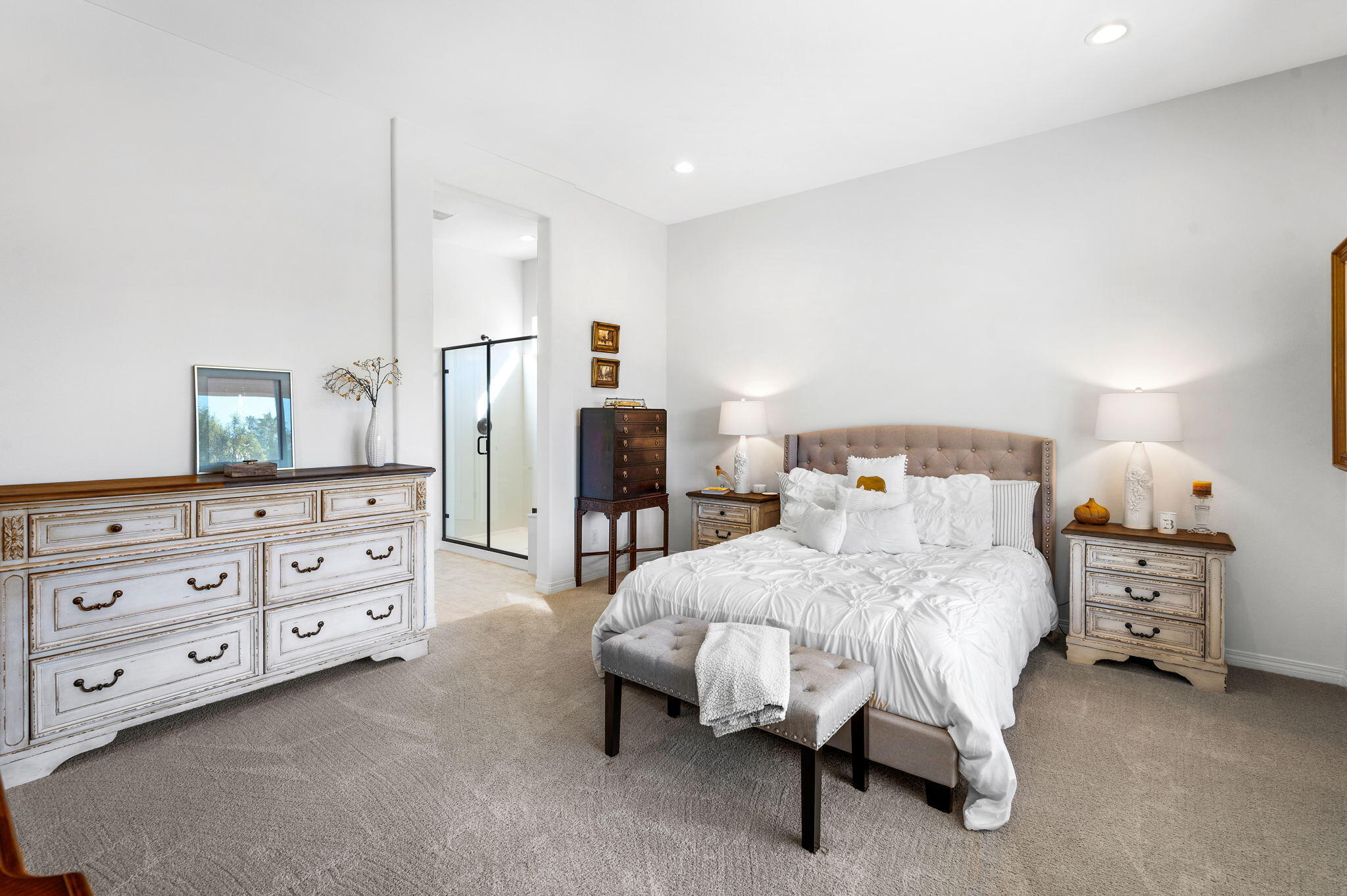 67 Cabernet Rancho Mirage, CA 92270 - Photo 20 of 41 a bedroom with a bed a dresser and a mirror