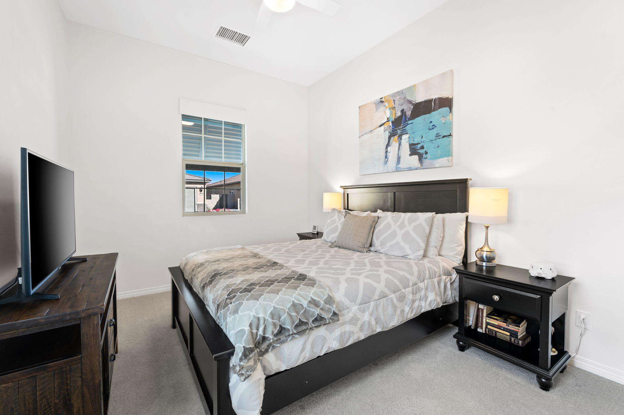 67 Cabernet Rancho Mirage, CA 92270 - Photo 25 of 41 a bedroom with a bed and a tv on table