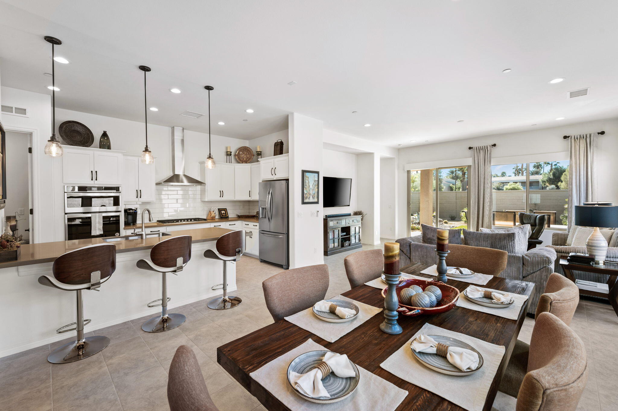 67 Cabernet Rancho Mirage, CA 92270 - Photo 27 of 41 a living room with lots of furniture and a chandelier