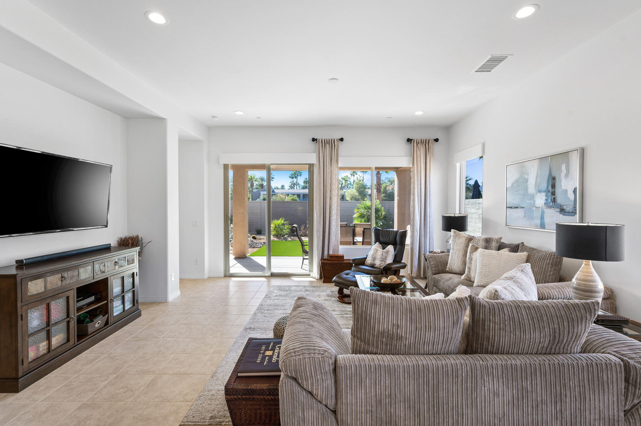 67 Cabernet Rancho Mirage, CA 92270 - Photo 28 of 41 a living room with furniture and a flat screen tv