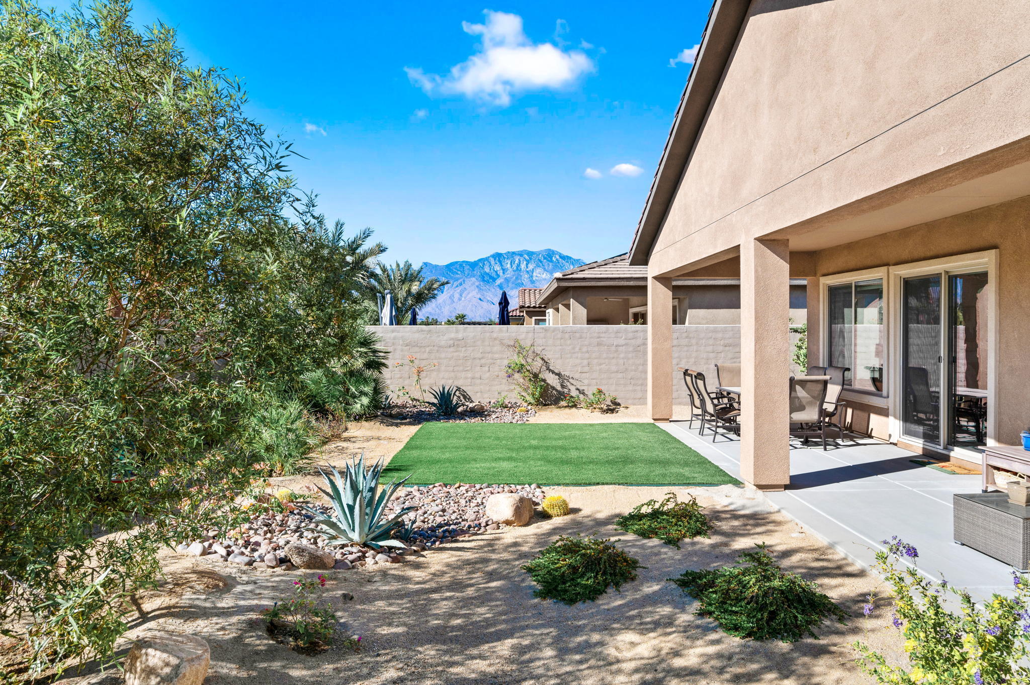 67 Cabernet Rancho Mirage, CA 92270 - Photo 30 of 41 a front view of a house with garden