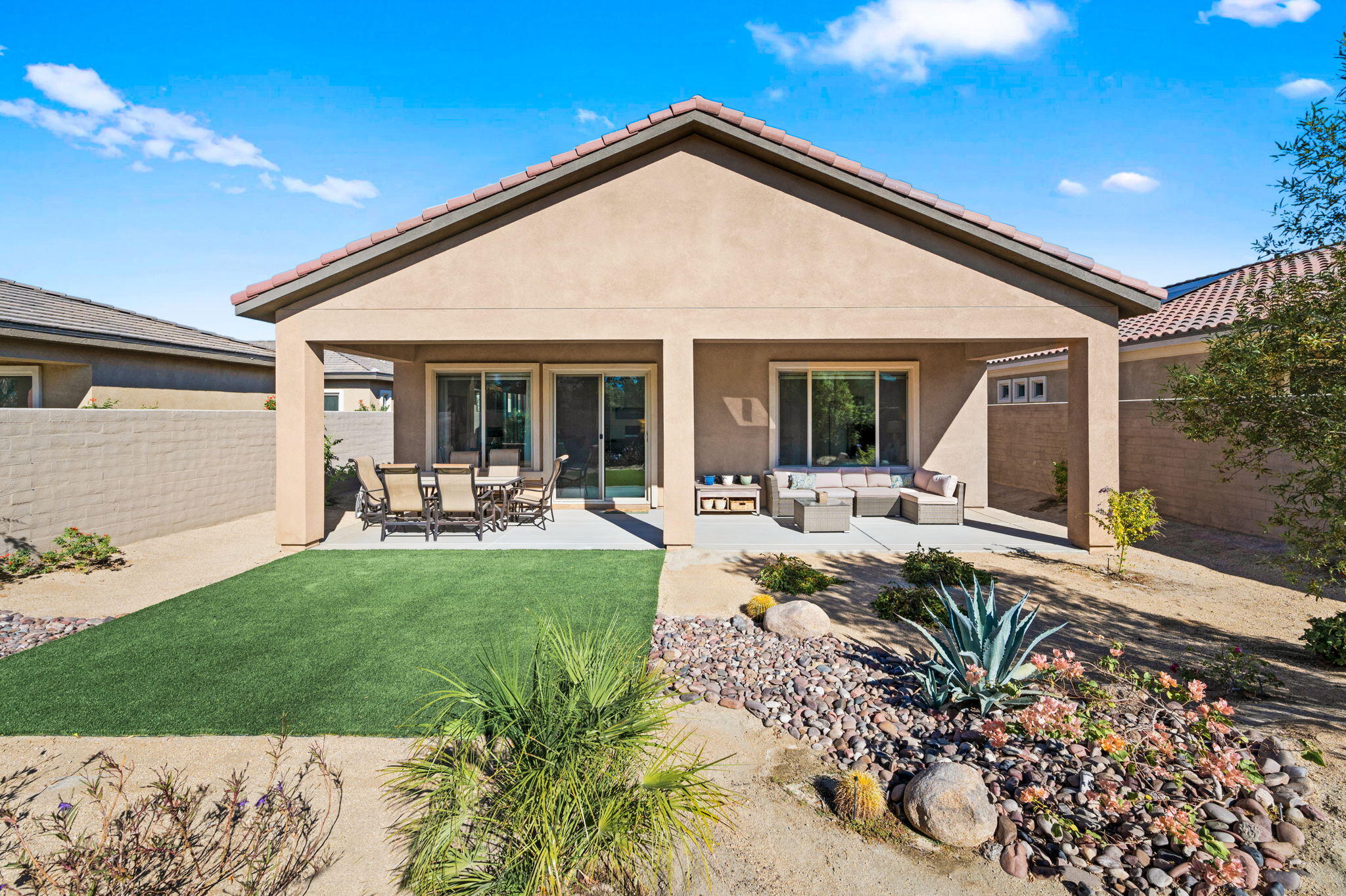 67 Cabernet Rancho Mirage, CA 92270 - Photo 31 of 41 a view of a house with backyard sitting area and garden