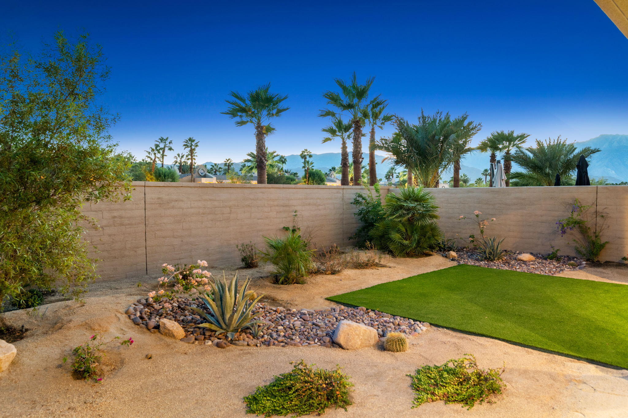 67 Cabernet Rancho Mirage, CA 92270 - Photo 39 of 41 a view of a backyard with a garden