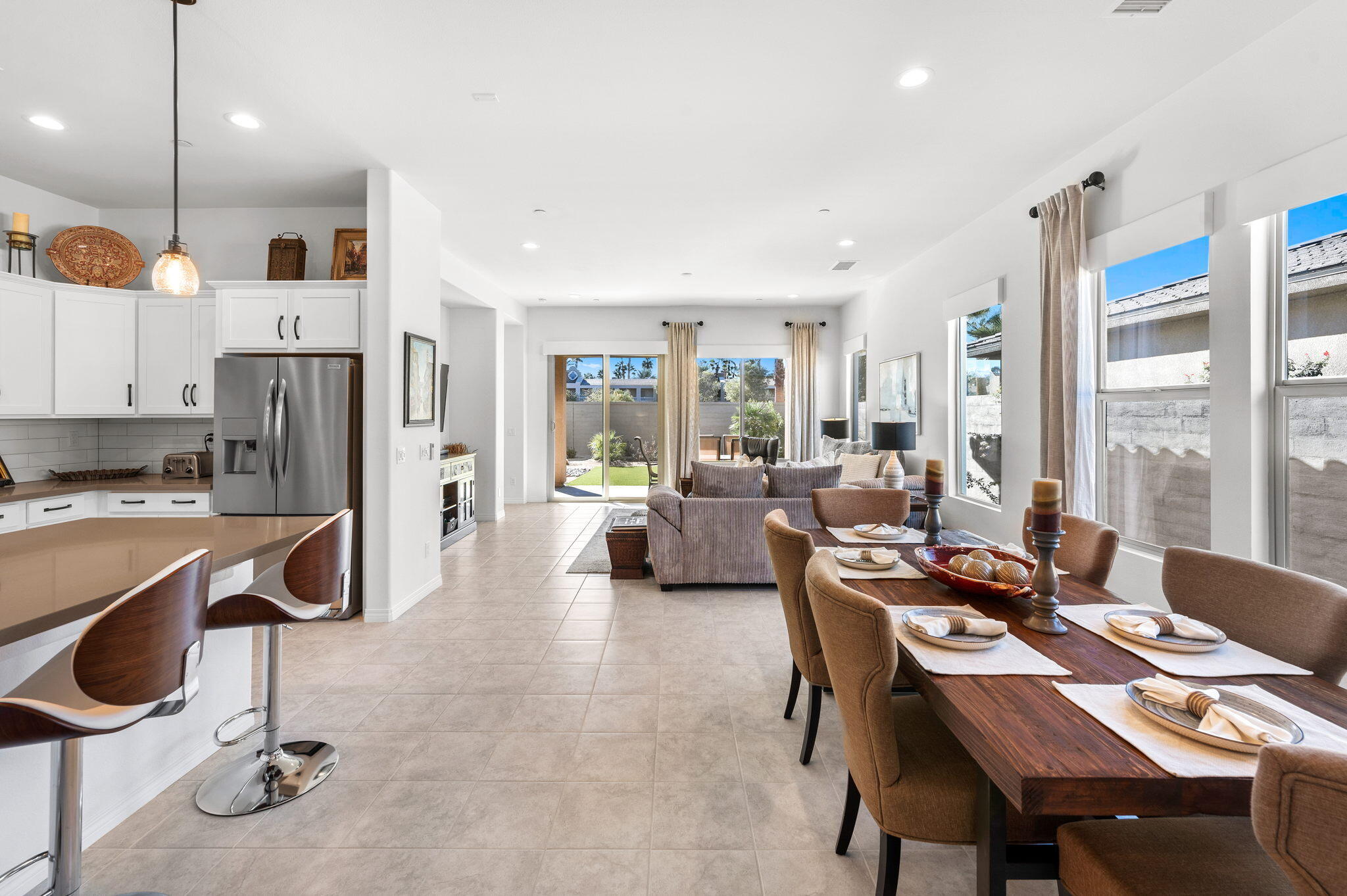 67 Cabernet Rancho Mirage, CA 92270 - Photo 9 of 41 a living room with stainless steel appliances kitchen island granite countertop furniture and a view of kitchen
