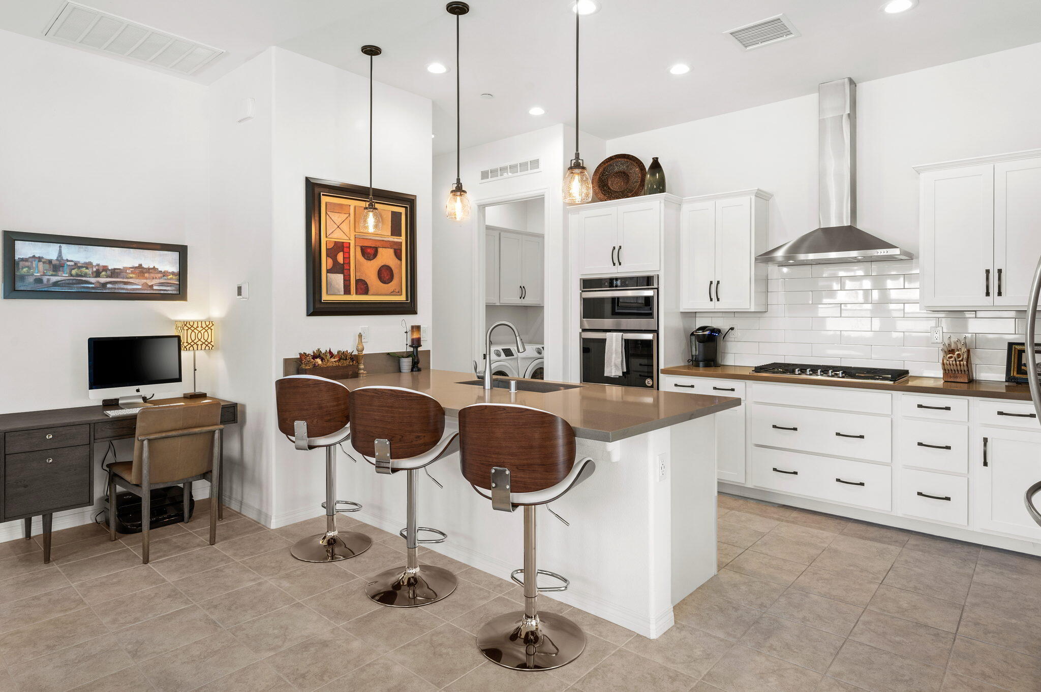 67 Cabernet Rancho Mirage, CA 92270 - Photo 10 of 41 a kitchen with stainless steel appliances kitchen island granite countertop a stove a sink and a refrigerator