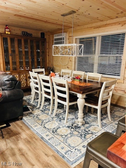2445 McCord Hill Road Wellsburg, WV 26070 - Photo 17 of 37 Dining room featuring wooden ceiling, wood walls, and light wood-style flooring