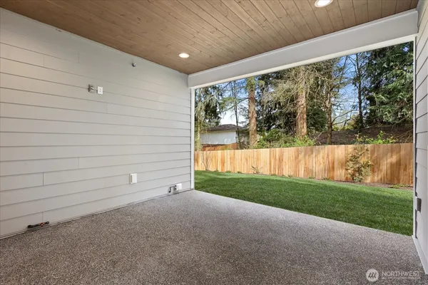 a view of a backyard of the house