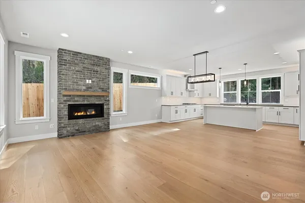 a view of a kitchen with furniture and a fireplace