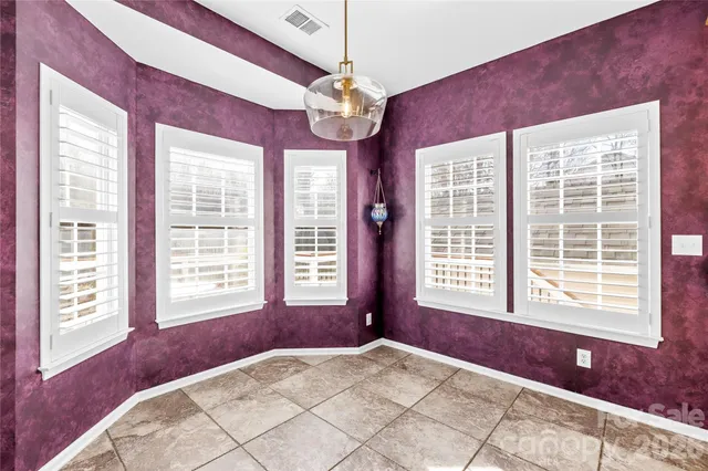 a kitchen with stainless steel appliances granite countertop a stove top oven a sink refrigerator and a microwave