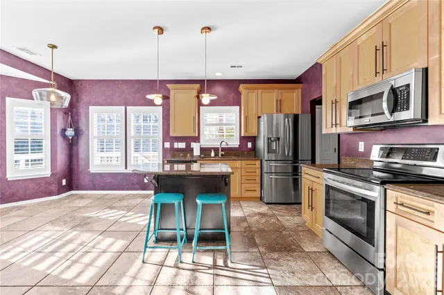 a bathroom with a sink mirror and vanity