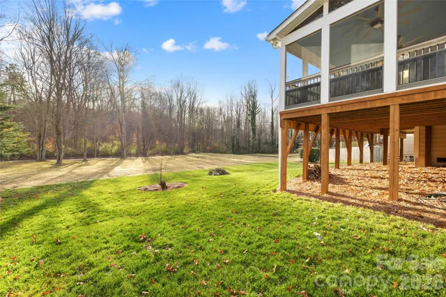 a front view of a house with a garden and plants