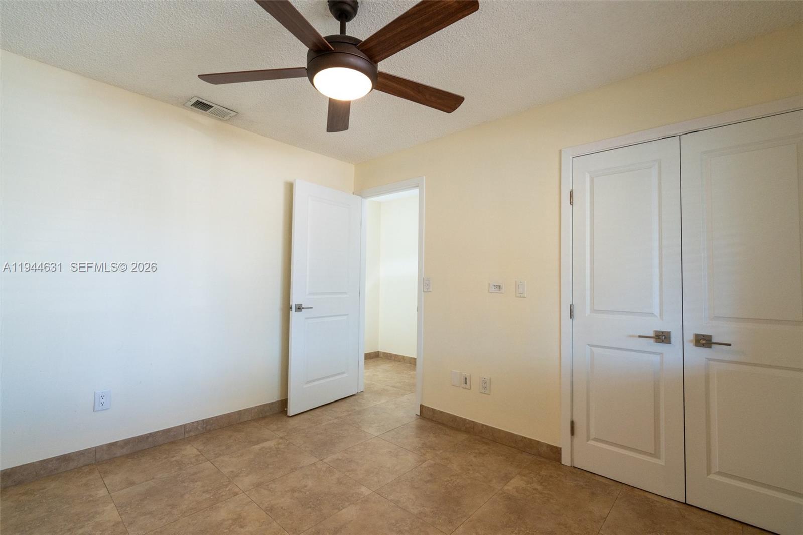 10116 Southwest 144th Place Miami, FL 33186 - Photo 18 of 28 wooden floor in an empty room