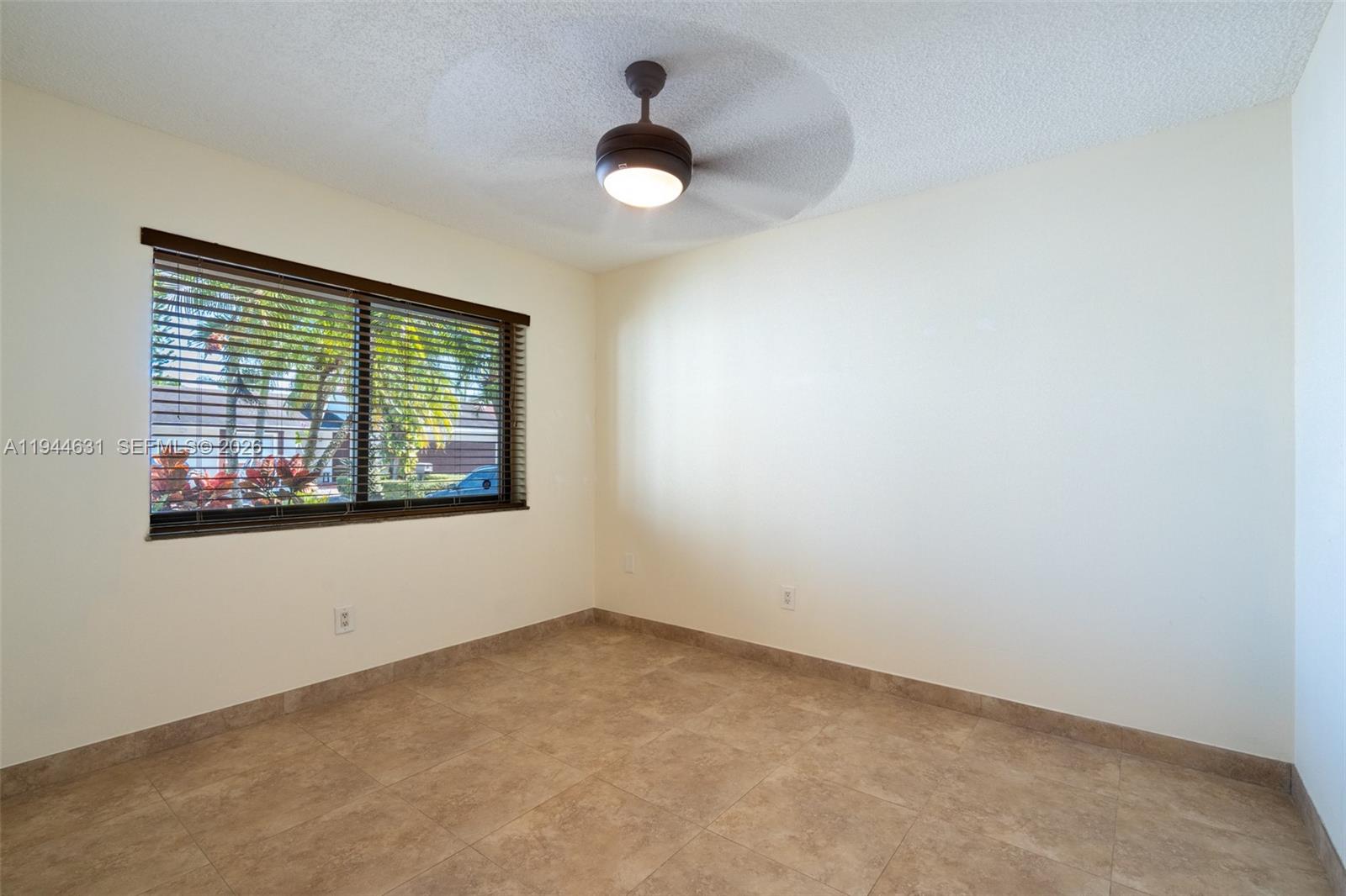 10116 Southwest 144th Place Miami, FL 33186 - Photo 20 of 28 an empty room with a window