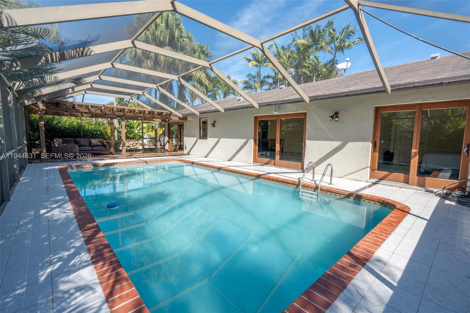 10116 Southwest 144th Place Miami, FL 33186 - Photo 2 of 28 a view of a house with a backyard