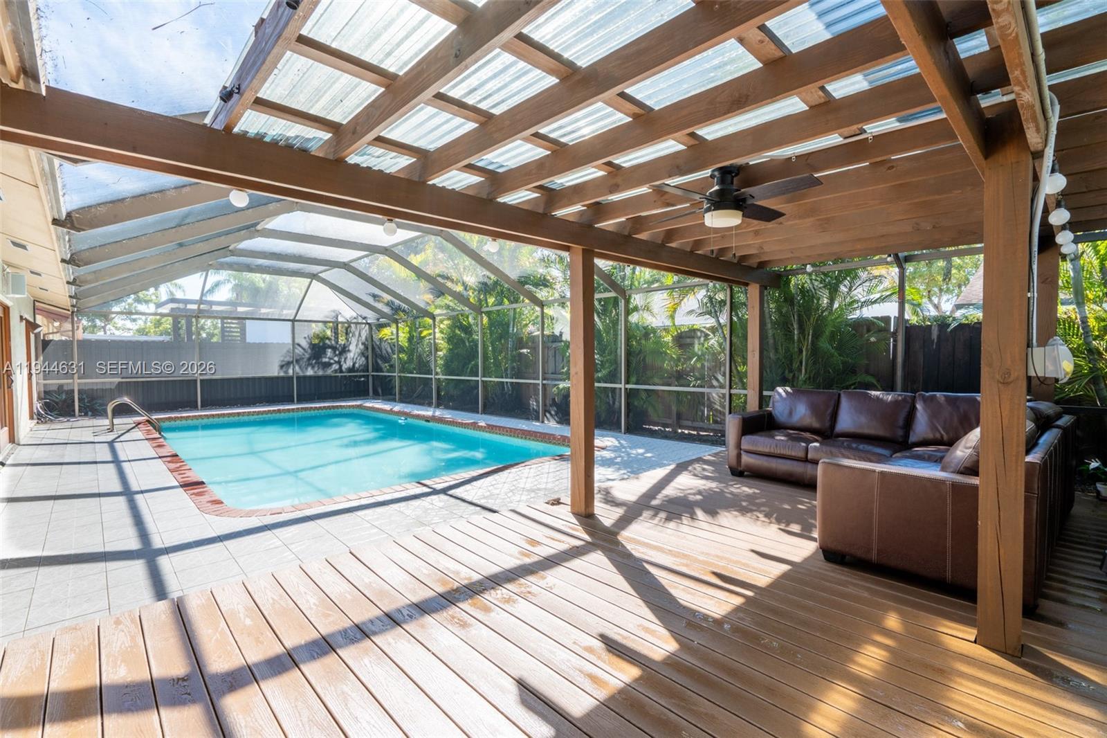 10116 Southwest 144th Place Miami, FL 33186 - Photo 25 of 28 a view of a patio with wooden floor