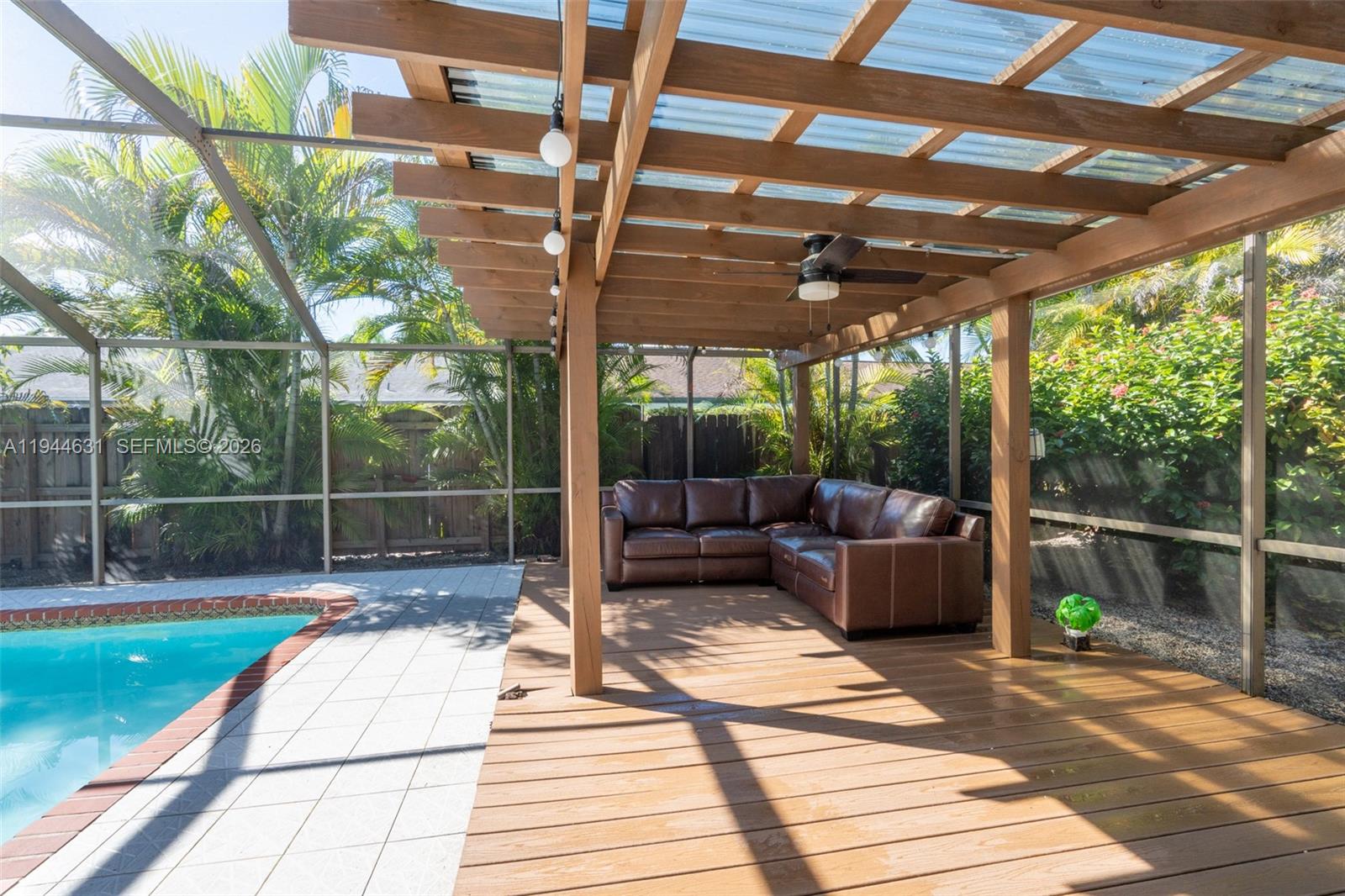 10116 Southwest 144th Place Miami, FL 33186 - Photo 26 of 28 a patio view with a table and chairs