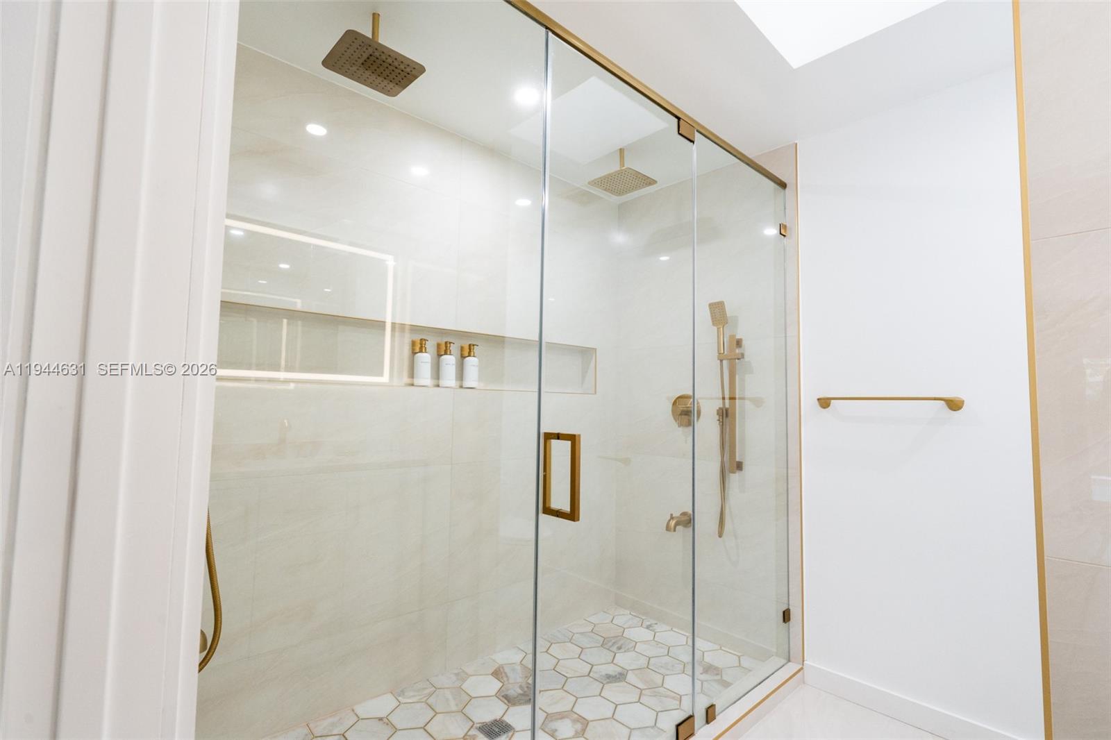 10116 Southwest 144th Place Miami, FL 33186 - Photo 3 of 28 a bathroom with a shower and a sink