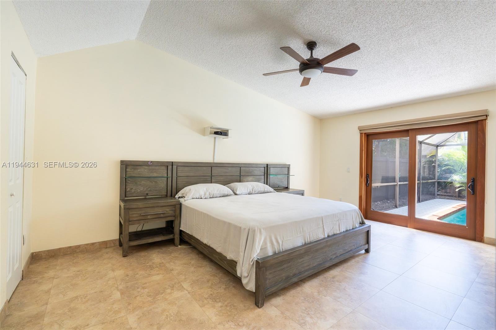 10116 Southwest 144th Place Miami, FL 33186 - Photo 6 of 28 a bedroom with a bed and window