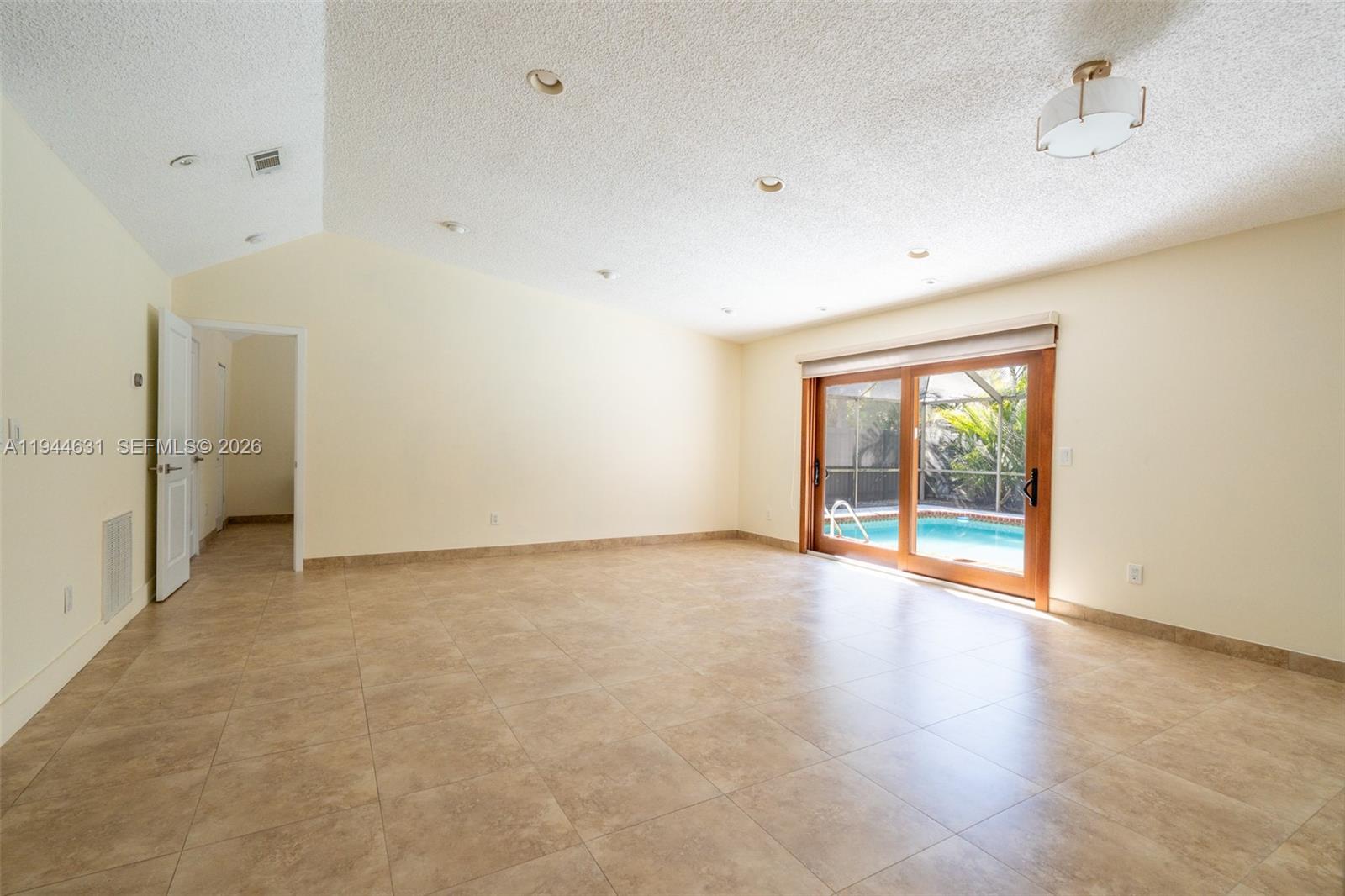 10116 Southwest 144th Place Miami, FL 33186 - Photo 10 of 28 a view of an empty room with a window