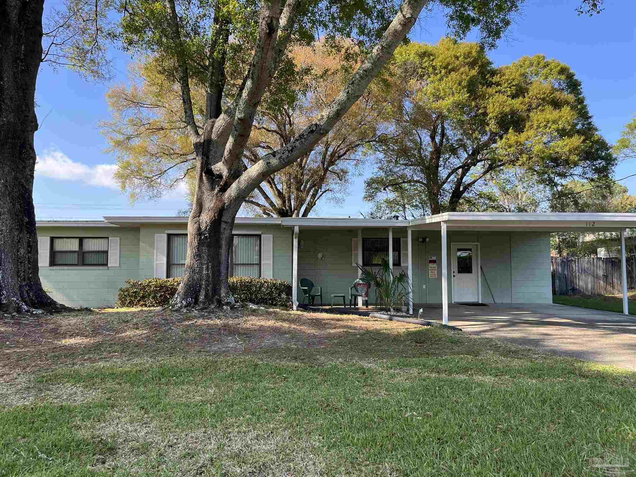 112 Benton Road Pensacola, FL 32506 - Photo 1 of 24 a front view of a house with a yard