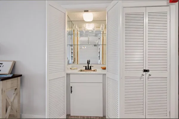 a bedroom with a bed and flat screen tv