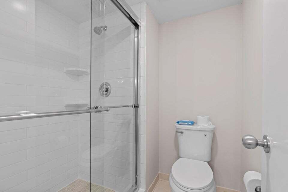 500 Ocean Trail Way, Unit 506 Jupiter, FL 33477 - Photo 17 of 28 a bathroom with a toilet and a shower