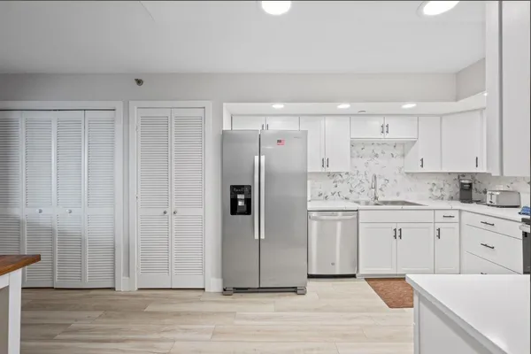 a bathroom with a sink and cabinets