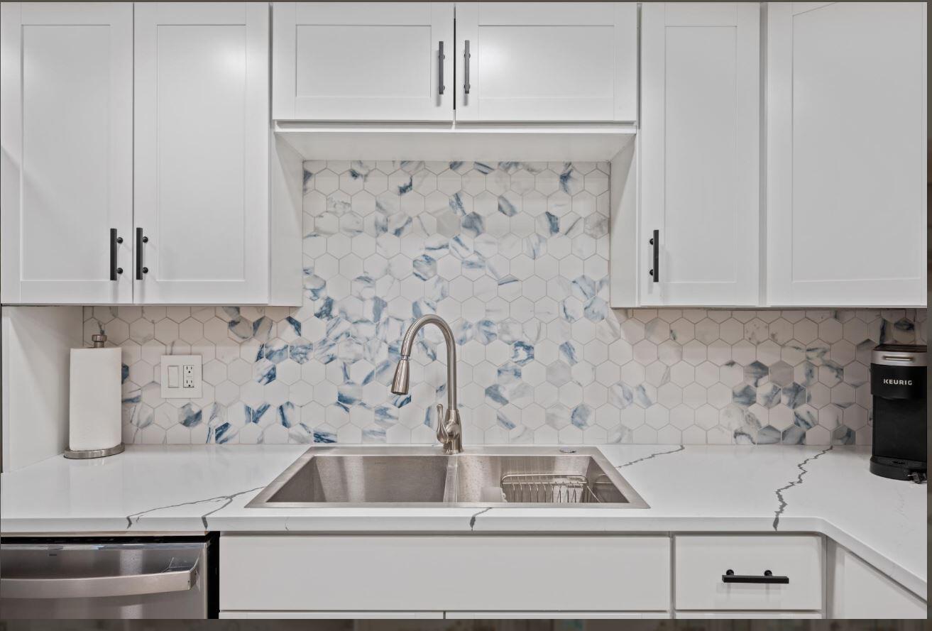 500 Ocean Trail Way, Unit 506 Jupiter, FL 33477 - Photo 6 of 28 a bathroom with a sink and cabinets