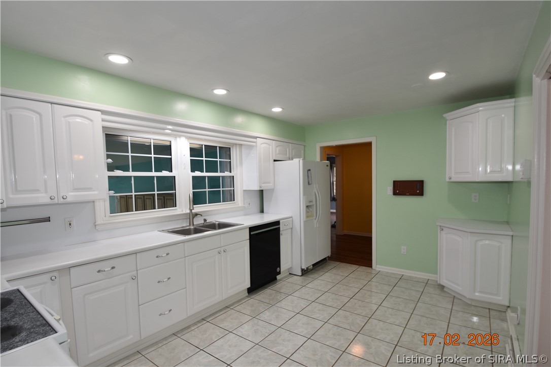 1905 Blackiston Mill Road Clarksville, IN 47129 - Photo 12 of 64 White cabinets and tile floor in the kitchen.