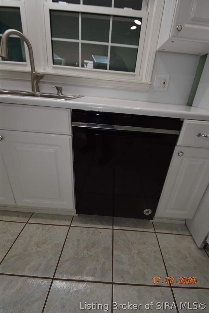 1905 Blackiston Mill Road Clarksville, IN 47129 - Photo 16 of 64 Dishwasher. Window looks out to the sunroom.
