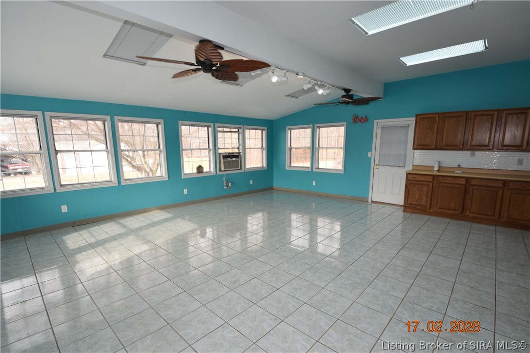 1905 Blackiston Mill Road Clarksville, IN 47129 - Photo 21 of 64 Sunroom has tile floor, skylights, ceiling fans.