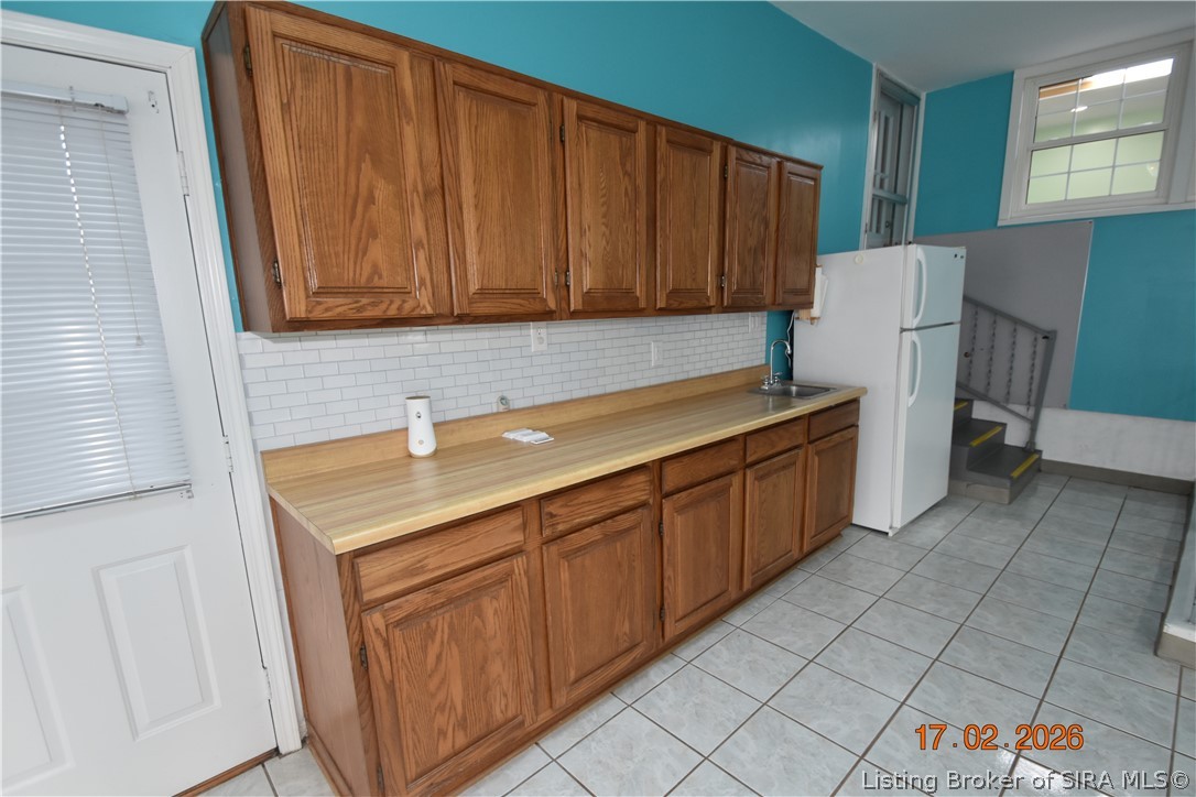 1905 Blackiston Mill Road Clarksville, IN 47129 - Photo 25 of 64 Sunroom cabinets, counters and sink.