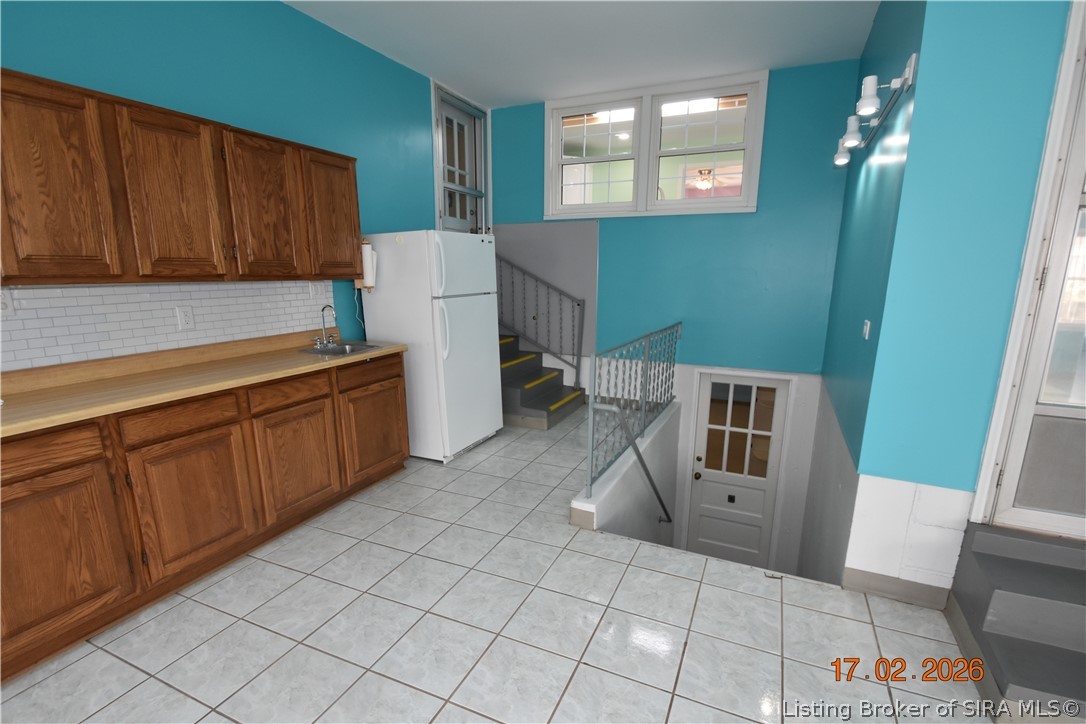 1905 Blackiston Mill Road Clarksville, IN 47129 - Photo 26 of 64 Window looks out from the kitchen. Steps lead to the basement door.