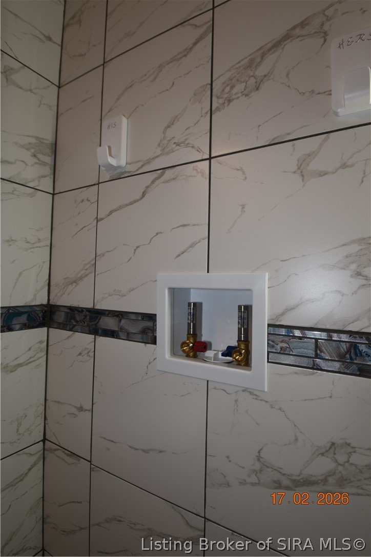 1905 Blackiston Mill Road Clarksville, IN 47129 - Photo 40 of 64 2nd floor bathroom has laundry hook up and space for stackable washer/dryer unit.