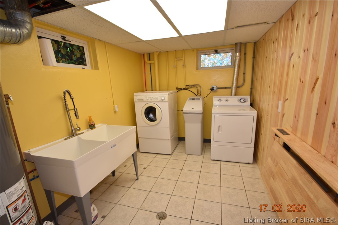 1905 Blackiston Mill Road Clarksville, IN 47129 - Photo 50 of 64 Basement Laundry room.Water Softener, Sink and soft drop folding table.
