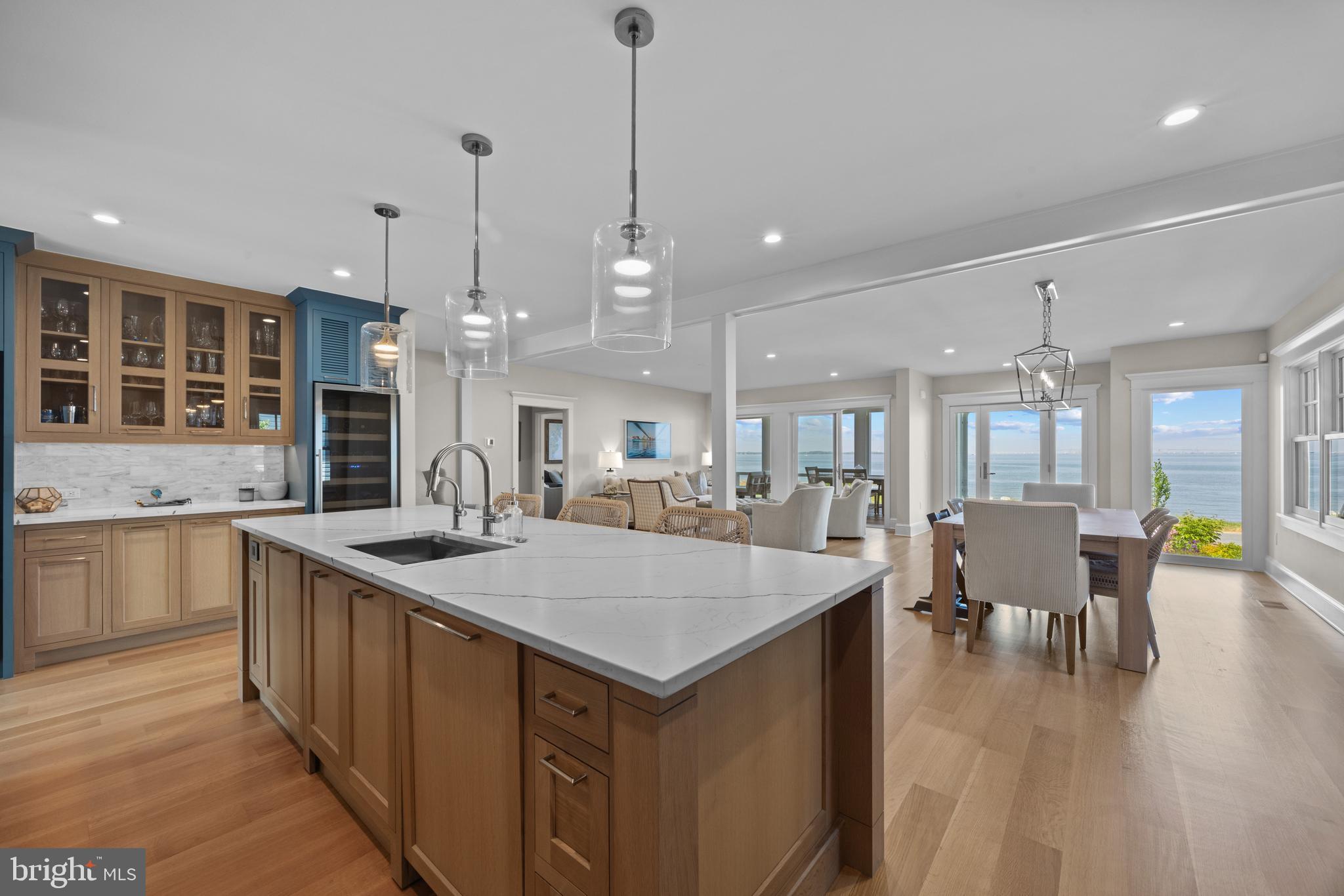 54 River Drive Annapolis, MD 21403 - Photo 10 of 43 a large kitchen with kitchen island a sink table and chairs