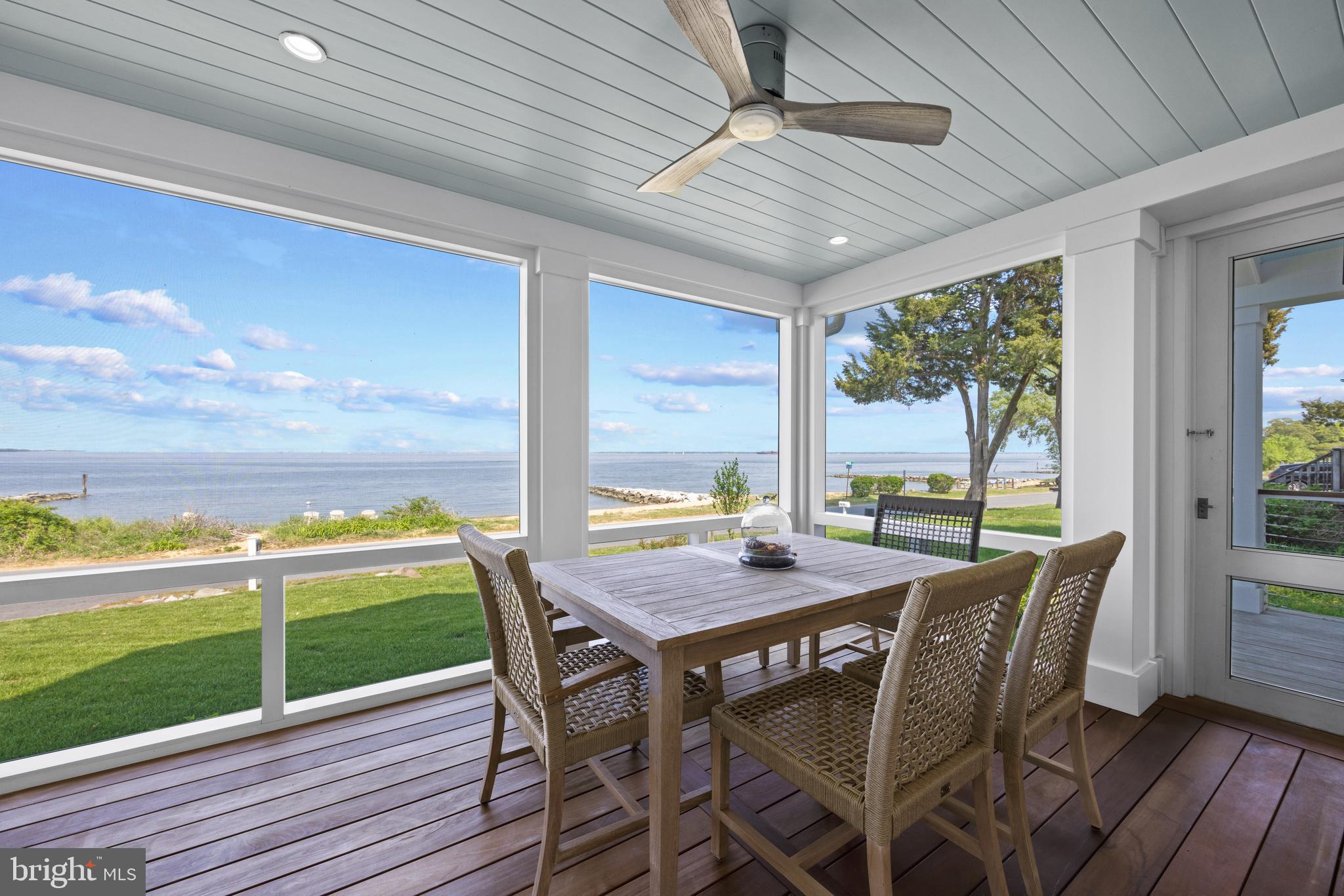 54 River Drive Annapolis, MD 21403 - Photo 13 of 43 a view of an outside dining space with furniture window and wooden floor