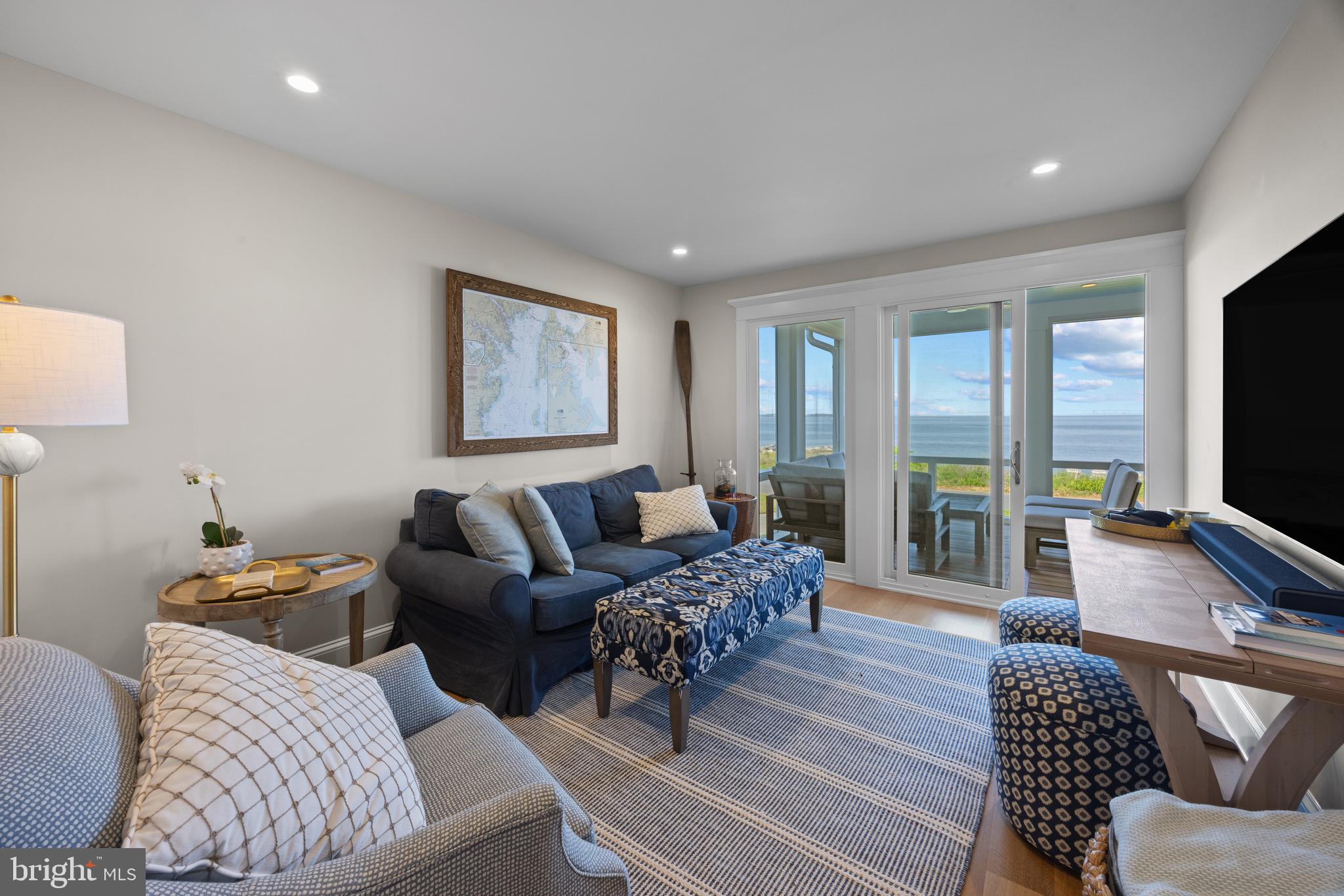 54 River Drive Annapolis, MD 21403 - Photo 14 of 43 a living room with furniture a flat screen tv and a large window