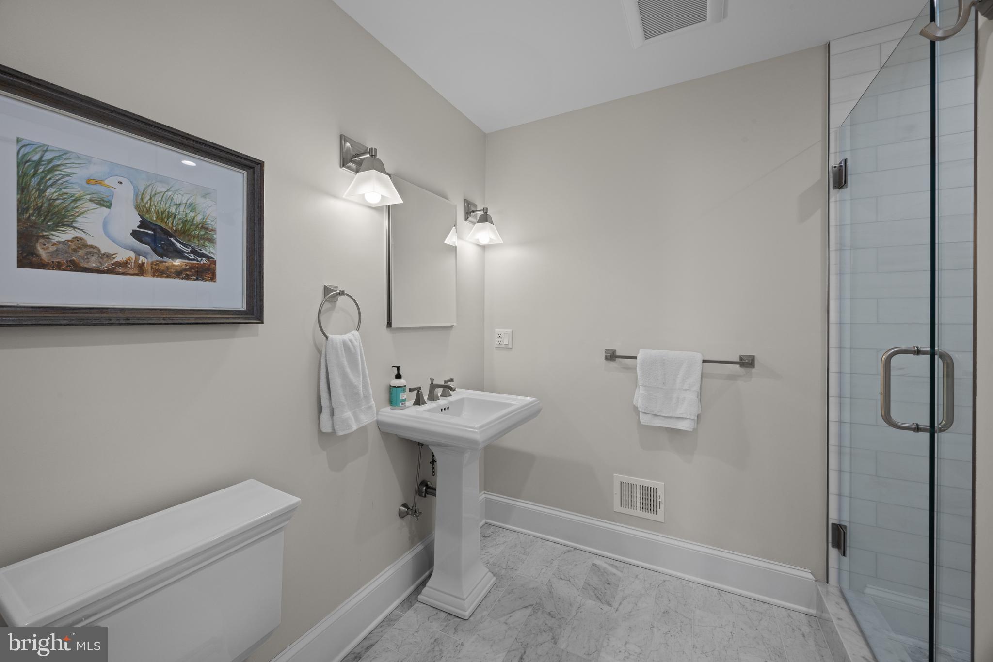 54 River Drive Annapolis, MD 21403 - Photo 17 of 43 a bathroom with a toilet a sink and mirror