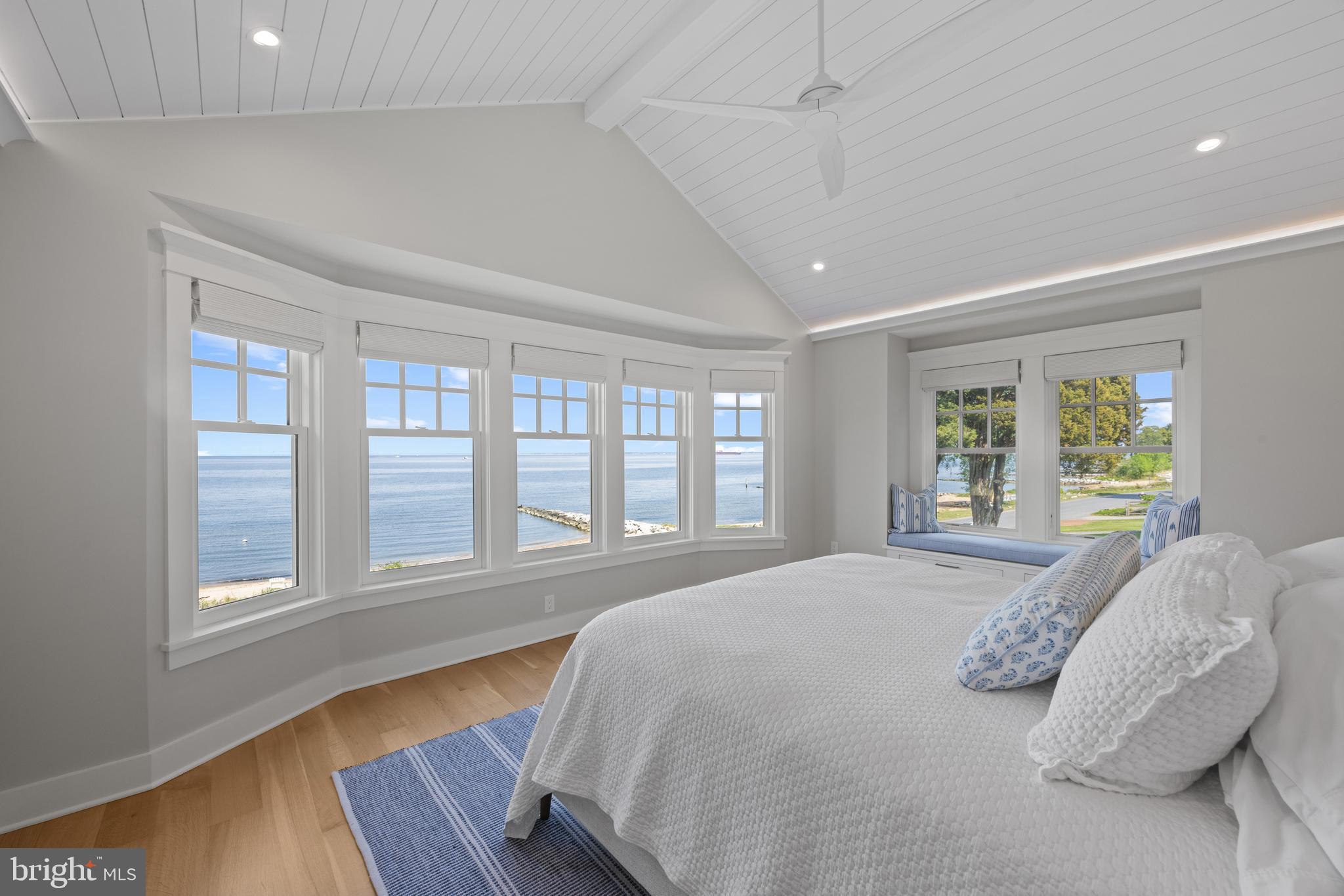 54 River Drive Annapolis, MD 21403 - Photo 22 of 43 a spacious bedroom with a bed and wooden floor