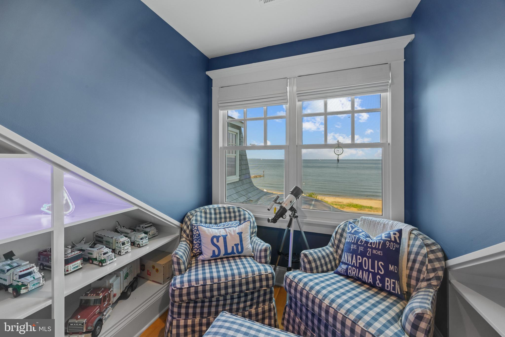 54 River Drive Annapolis, MD 21403 - Photo 28 of 43 a living room with furniture and a floor to ceiling window