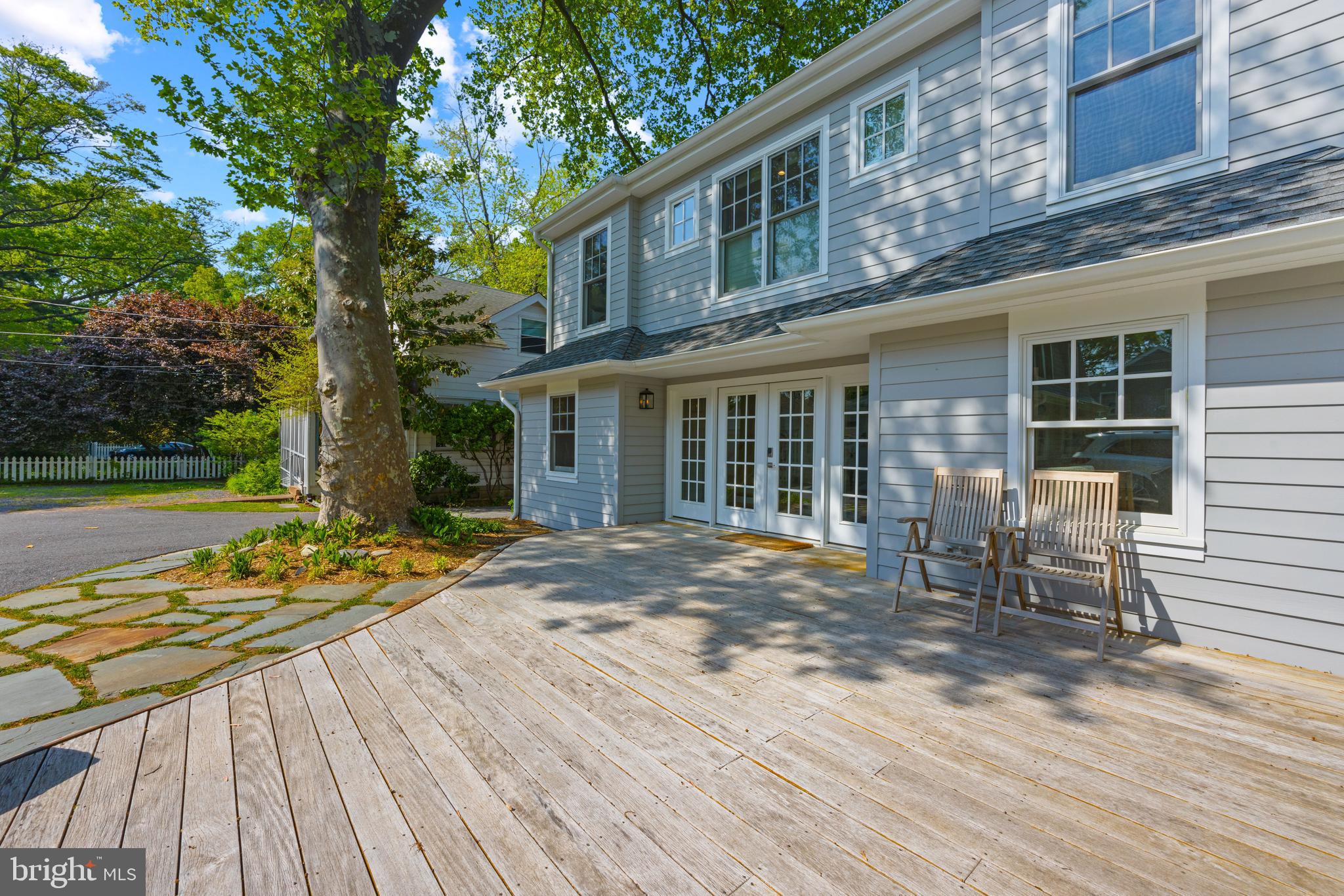 54 River Drive Annapolis, MD 21403 - Photo 33 of 43 a blue bench sitting in front of a building