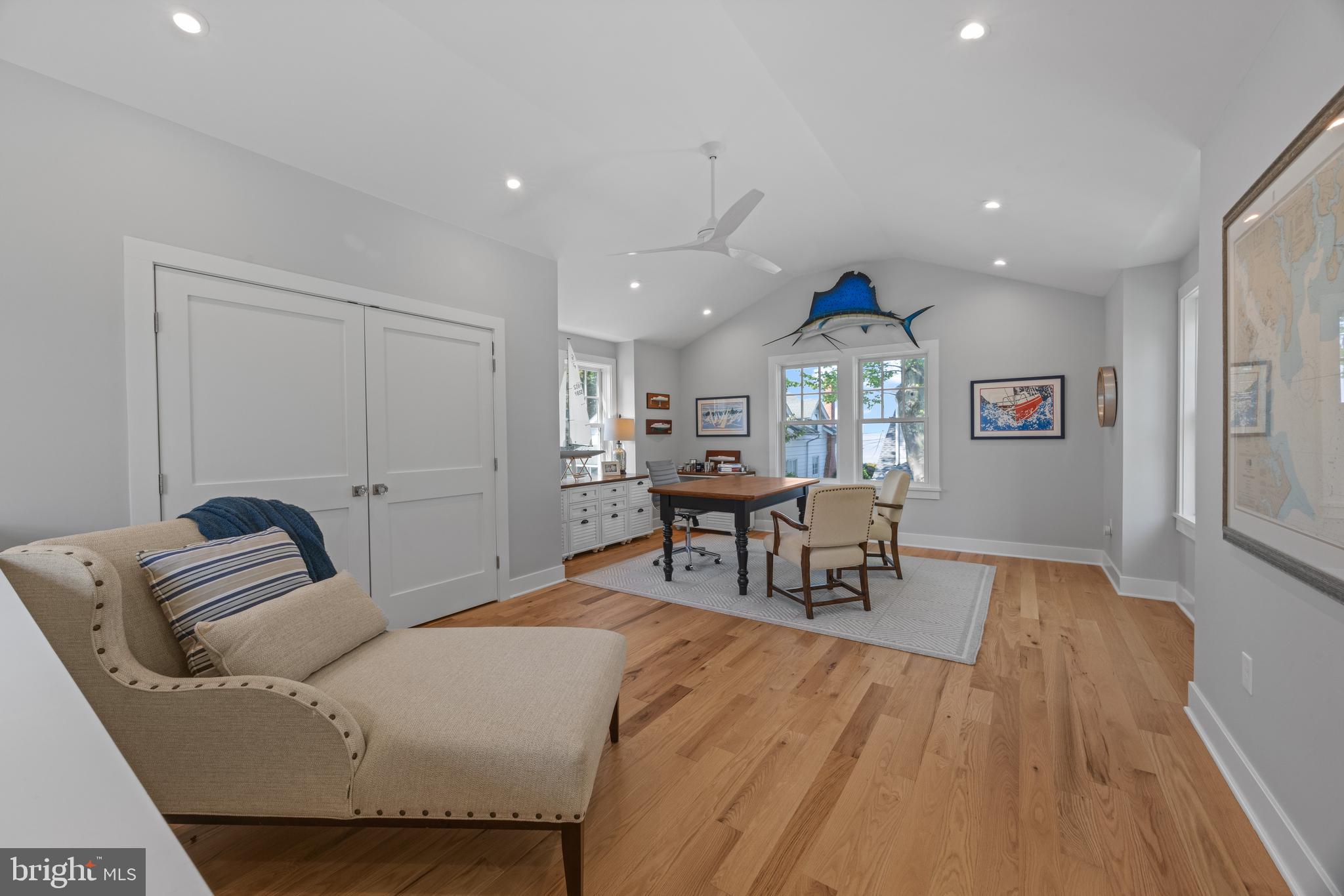 54 River Drive Annapolis, MD 21403 - Photo 35 of 43 a living room with furniture and a chandelier