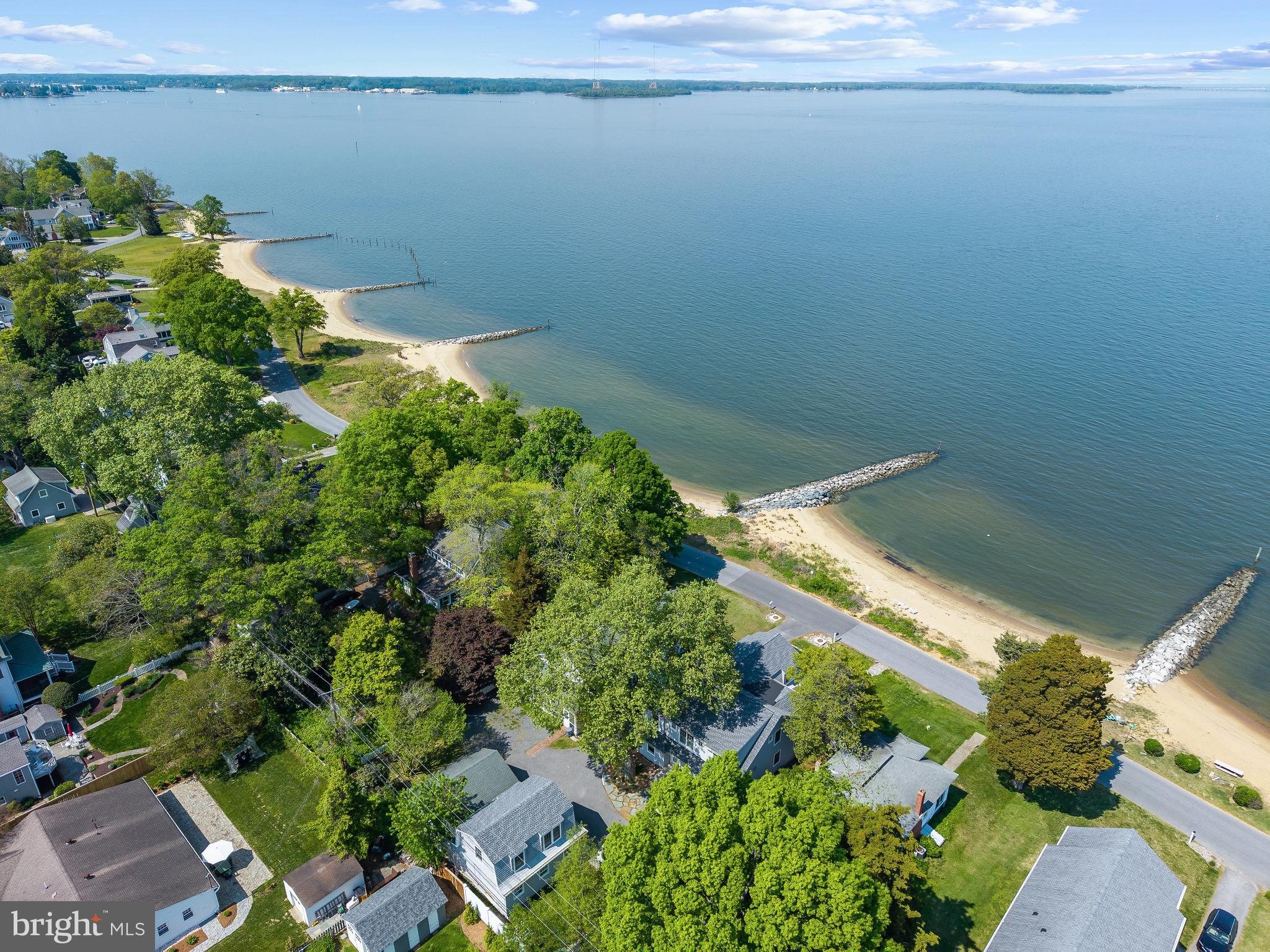 54 River Drive Annapolis, MD 21403 - Photo 41 of 43 a backyard of a house with lots of green space and a fountain
