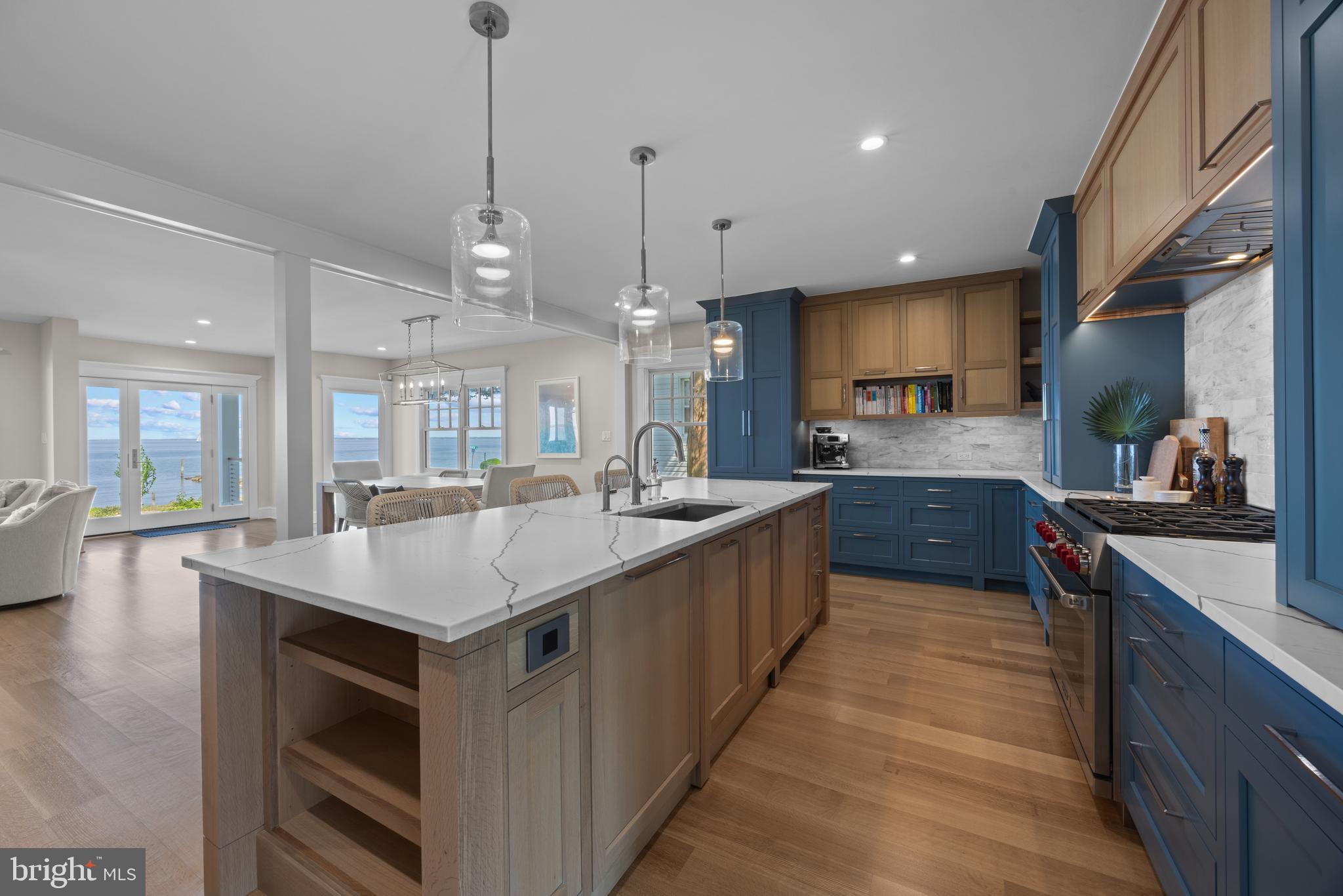 54 River Drive Annapolis, MD 21403 - Photo 9 of 43 a large kitchen with kitchen island a sink a counter space and stainless steel appliances