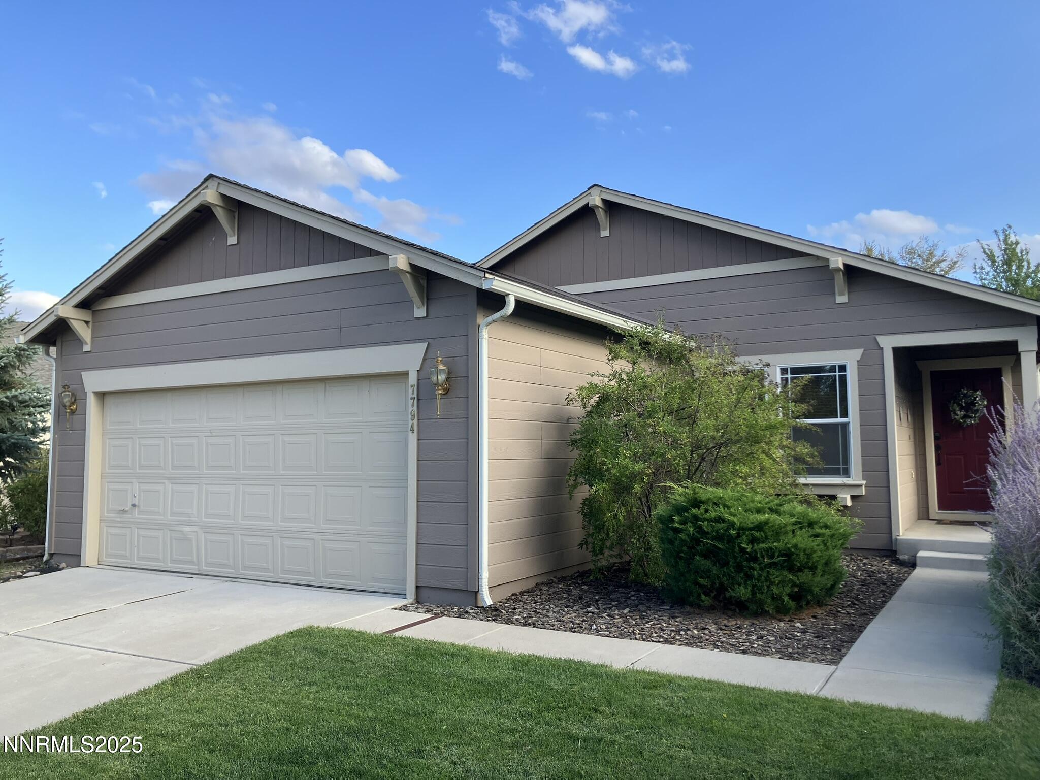 7794 Welsh Drive Reno, NV 89506 - Photo 1 of 26 a front view of house with yard and green space