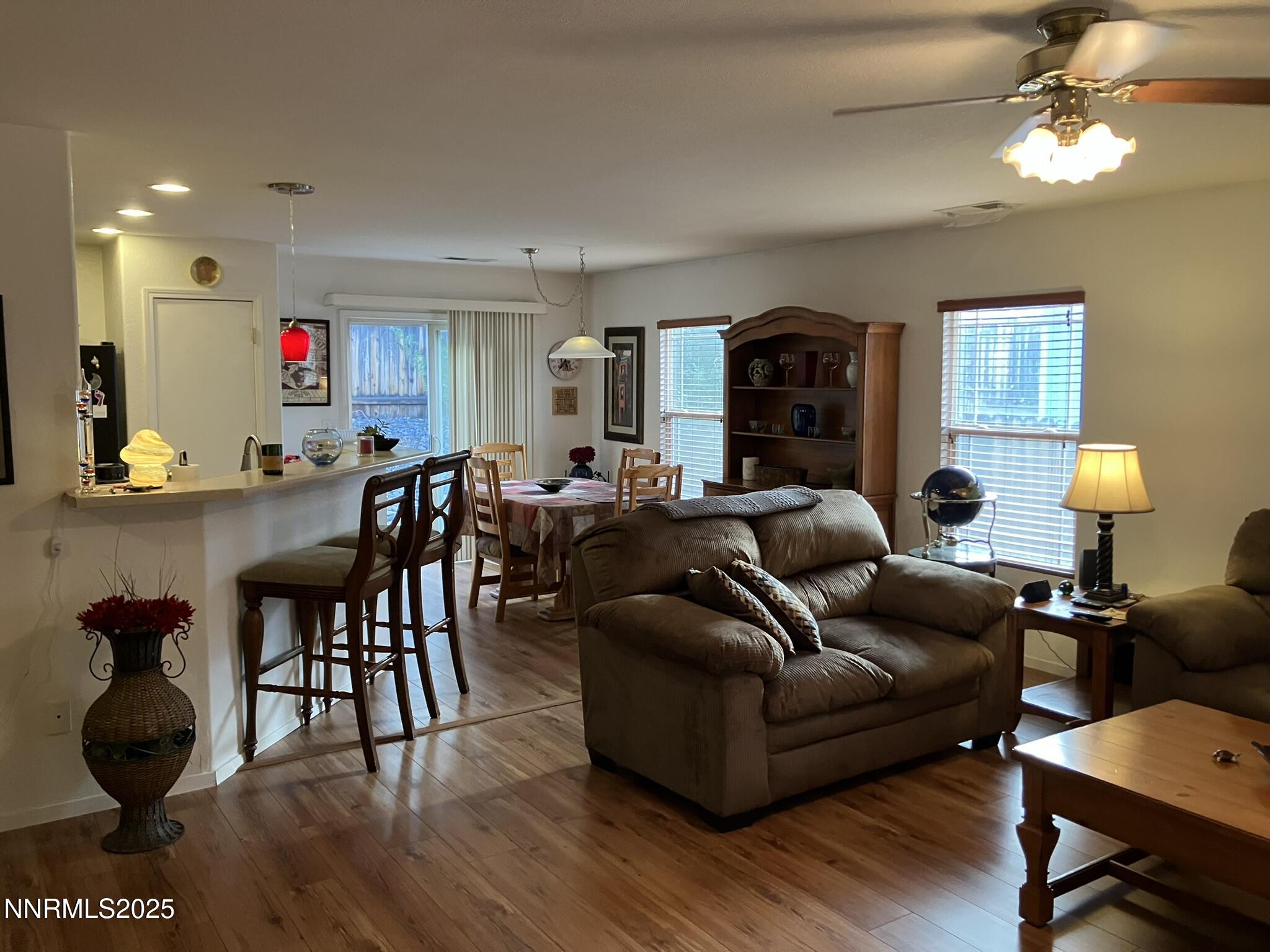 7794 Welsh Drive Reno, NV 89506 - Photo 5 of 26 a living room with furniture and a wooden floor