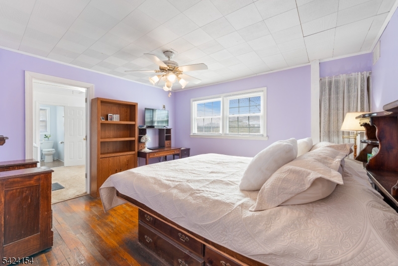 41 Swartswood Road Newton, NJ 07860 - Photo 13 of 22 a bedroom with a bed and a chandelier